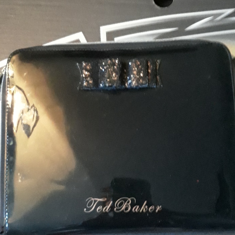 Ted Baker laptop carrier,  makeup bag.